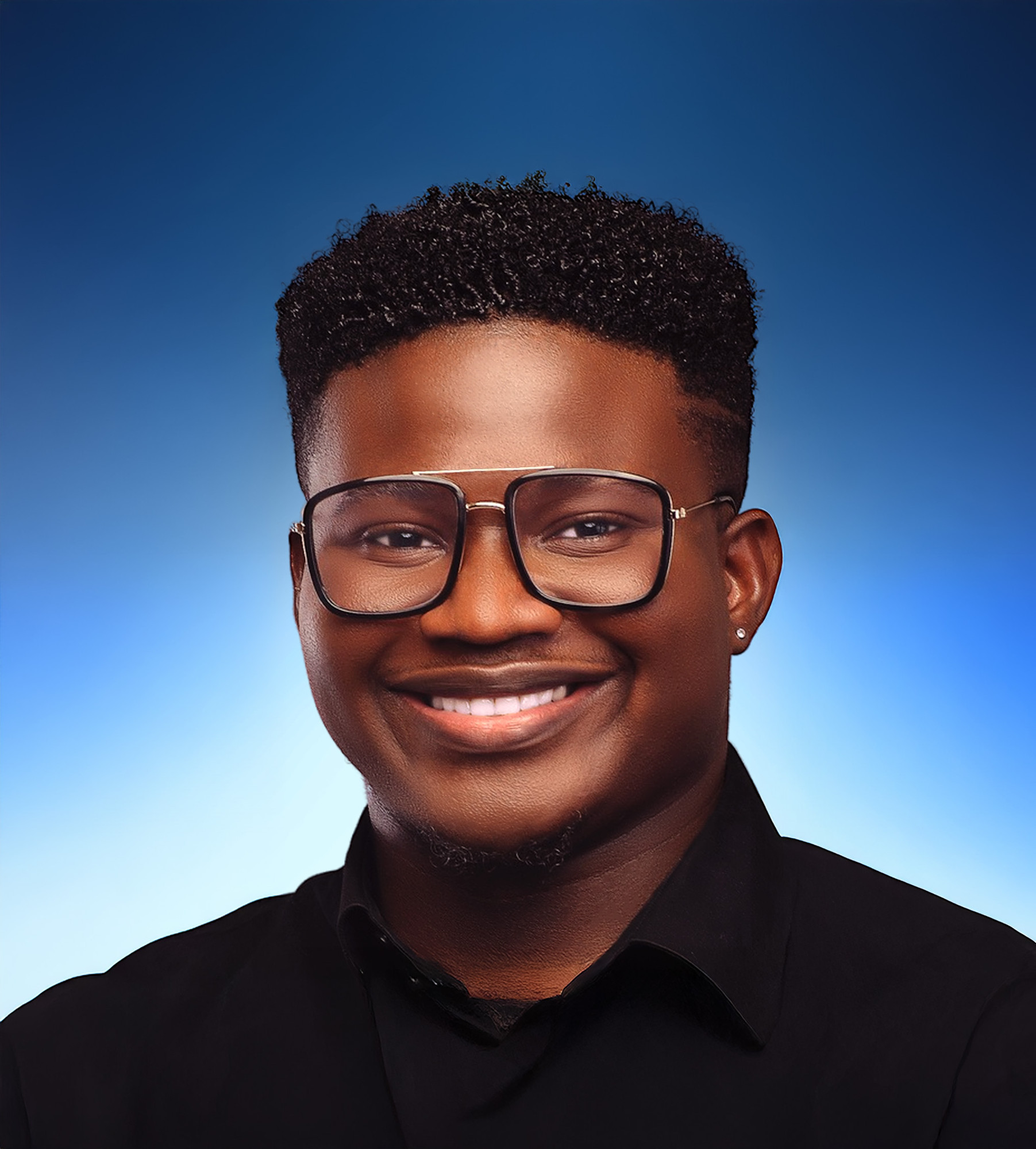 Portrait of Patrick Ngau, Latino, smiling, wearing glasses and a black shirt